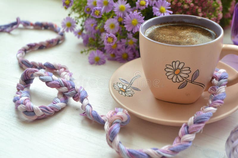 https://thumbs.dreamstime.com/b/cup-coffee-flower-wooden-background-image-violet-purple-white-colors-style-life-cup-coffee-flower-172857413.jpg