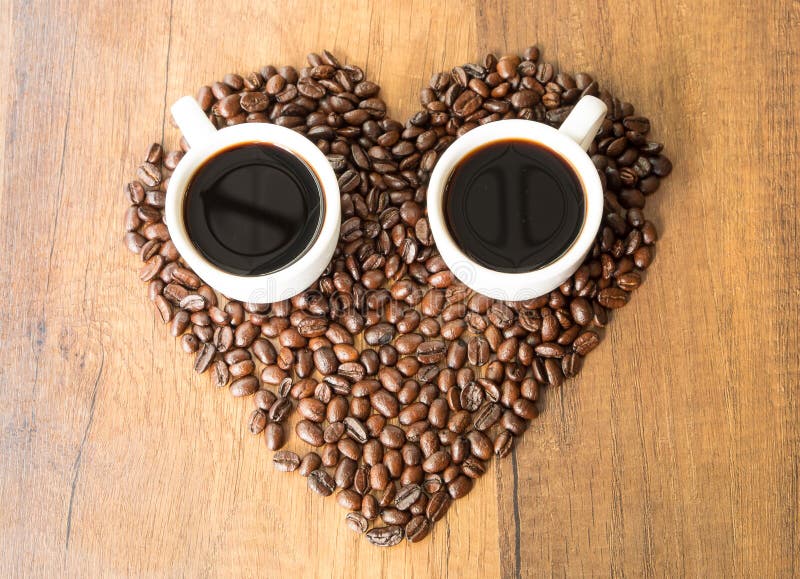 A Cup of Coffee and Heartshaped Coffee Beans Stock Photo Image of