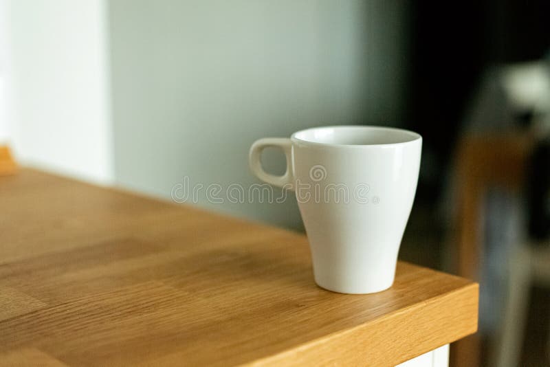 A cup of coffee in the kitchen. Scandinavian style stock image A cup of coffee in the kitchen. Scandinavian style stock image