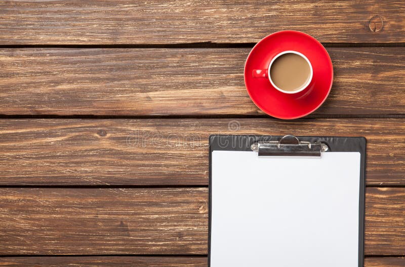 Cup of coffee latte and business tablet stock image