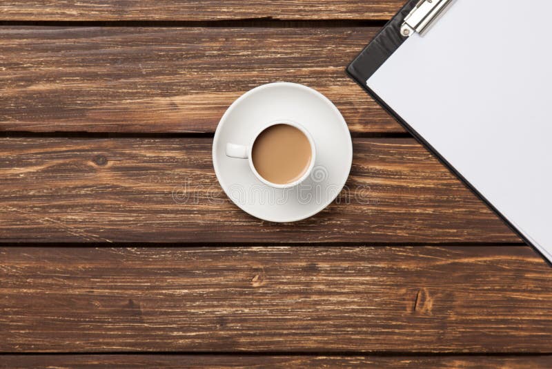 Cup of coffee latte and business tablet royalty free stock image