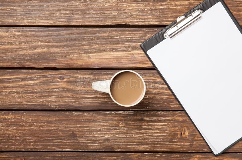 Cup of coffee latte and business tablet royalty free stock photos