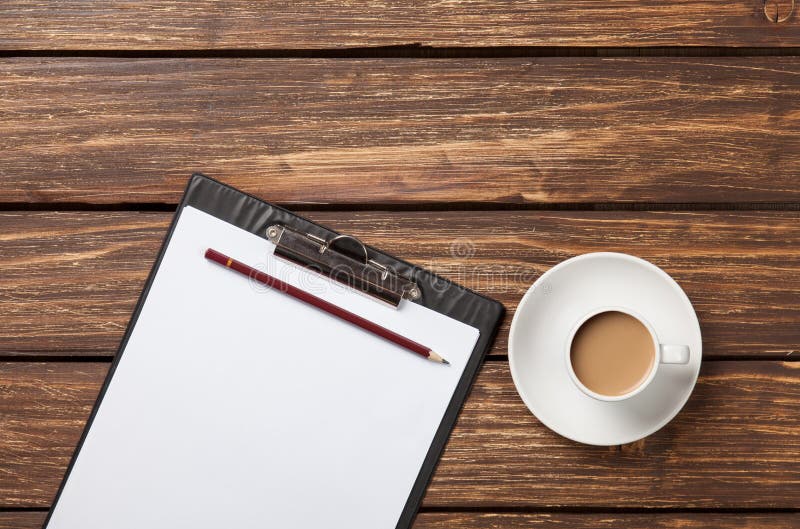 Cup of coffee latte and business tablet royalty free stock image