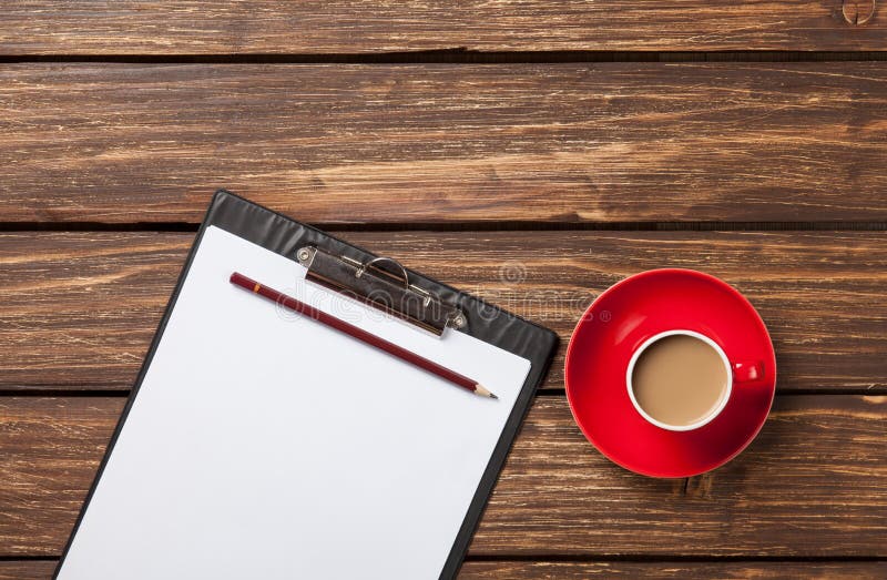 Cup of coffee latte and business tablet royalty free stock photography