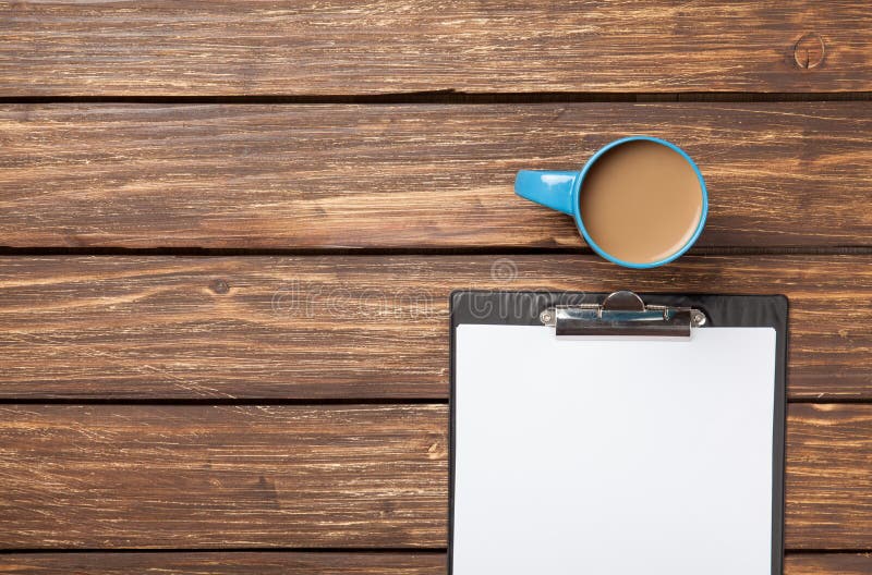 Cup of coffee latte and business tablet royalty free stock photography