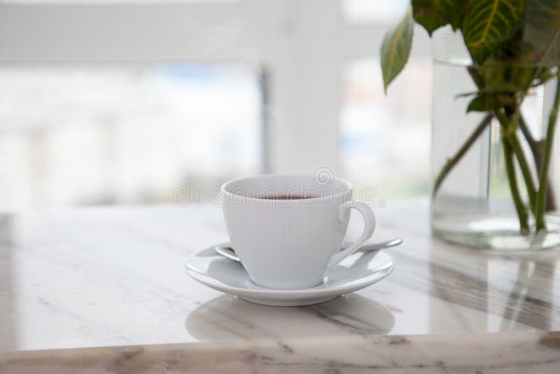 Cup of coffee on marble table