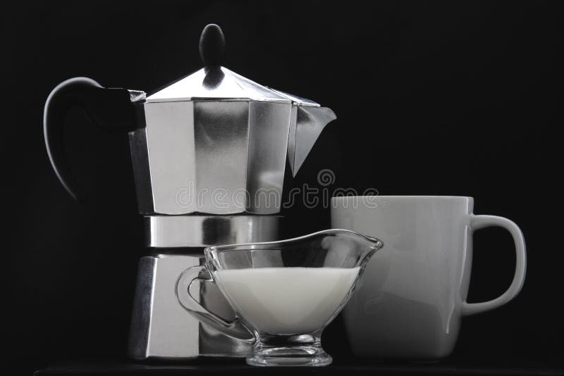 Cup of Coffee, Milk Jug and a Coffee Pot. Stock Photo Image of dishes