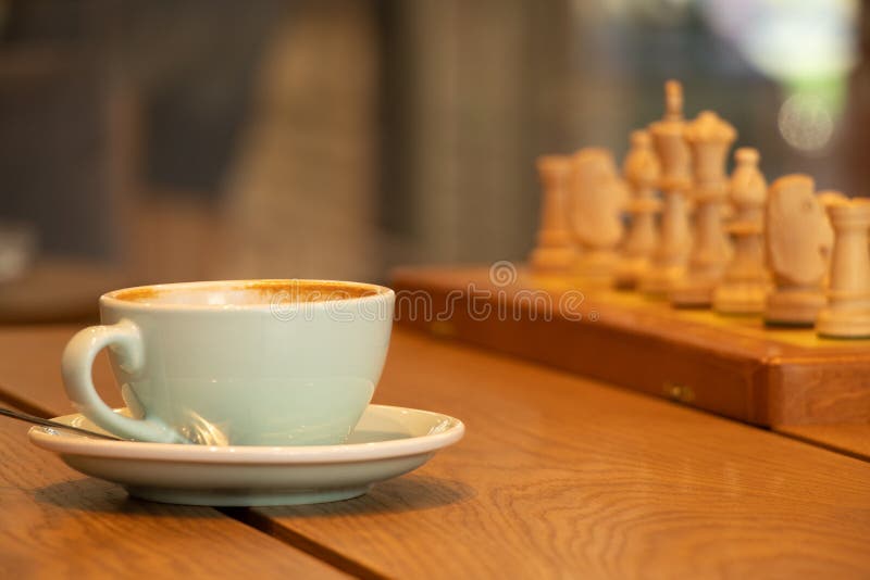 brown chess board with figures on a wooden table in a cafe, playing chess  Stock Photo - Alamy