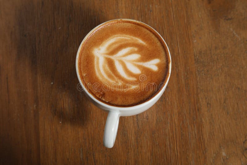 Cup of coffee nice draw in cream stock photography Cup of coffee nice draw in cream stock photography