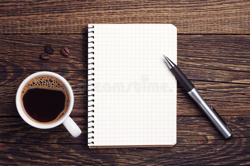 Cup of coffee and notepad