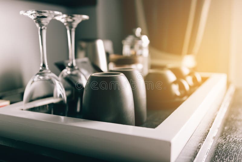 Cup of Coffee Placing on a Wooden Small Table in Hotel Room. Stock