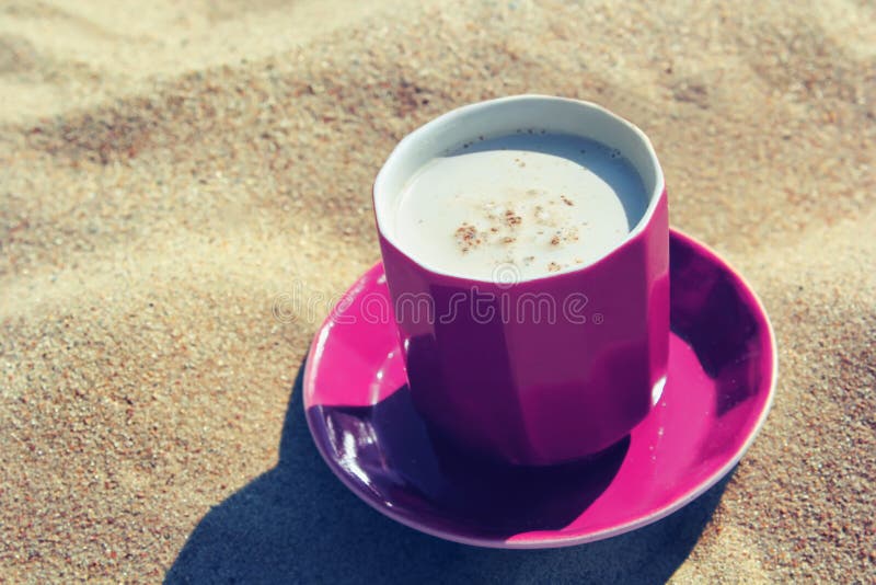 Cup coffee on sand stock image. Image of yellow, saucer 25170031