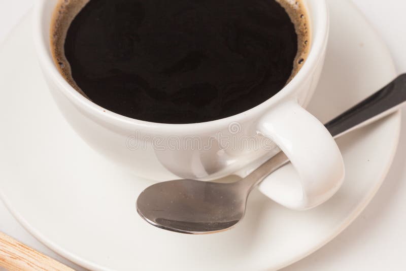 Cup of coffee with spoon stock image. Image of morning 109617173