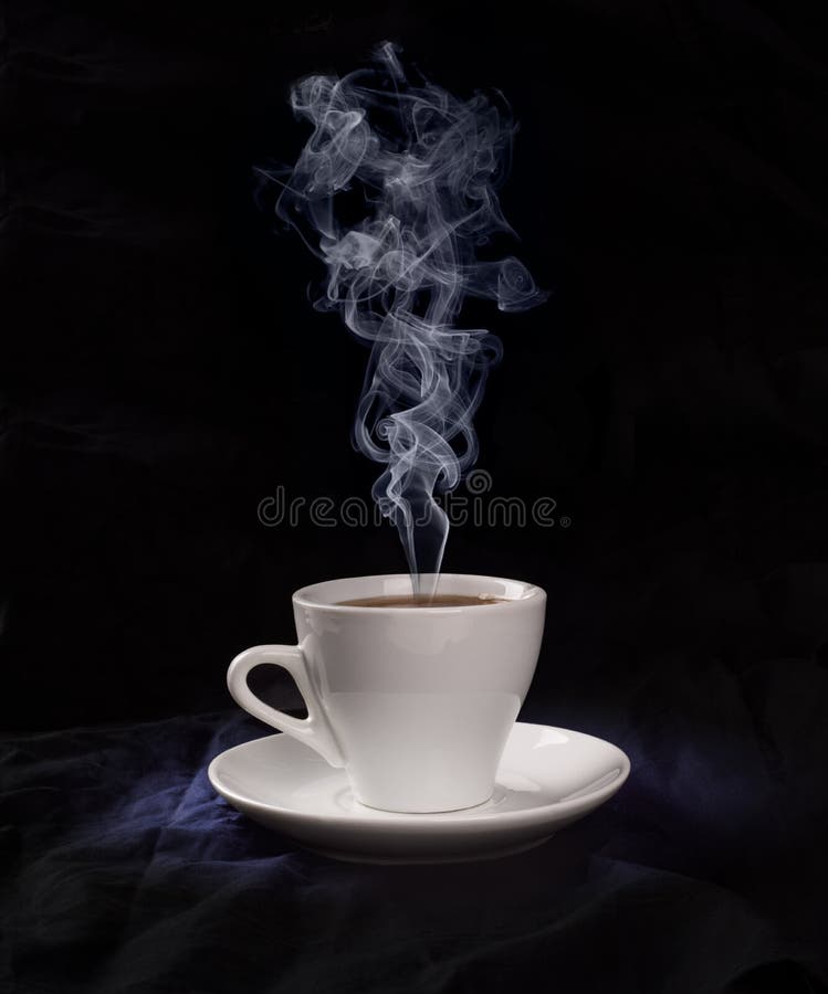 Cup with coffee and steam in cold light royalty free stock photo