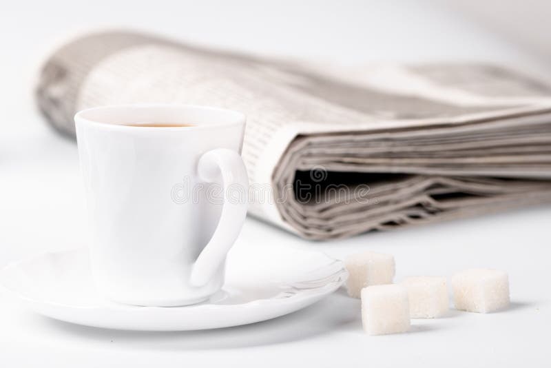 Cup of coffee, sugar and newspapers