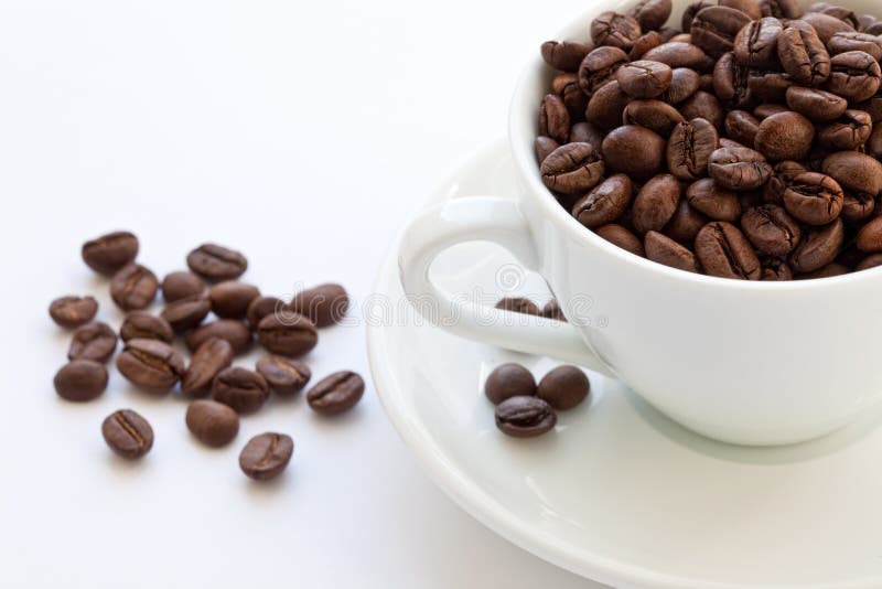 Cup full of coffee beans