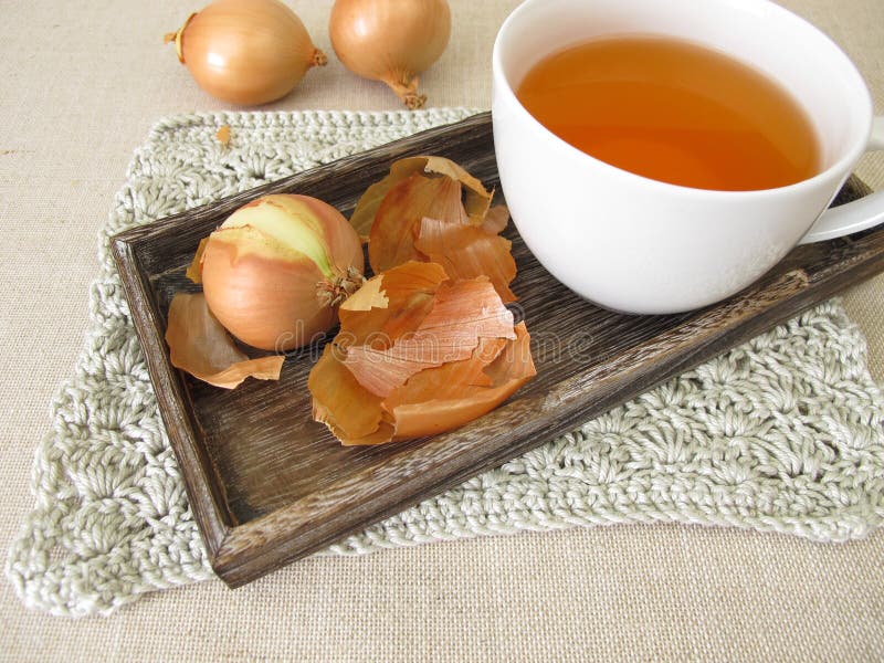A cup of onion peel tea stock photo. Image of brown 237768114