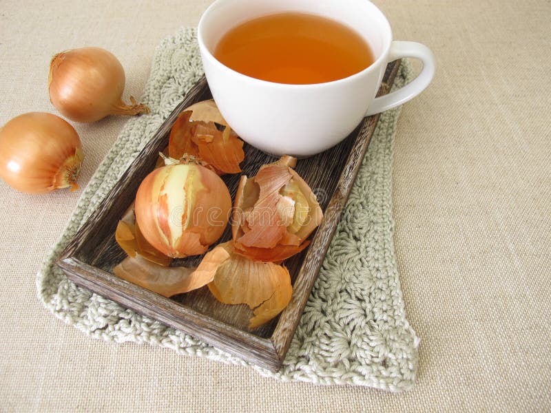A cup of onion peel tea stock image. Image of health 237768115