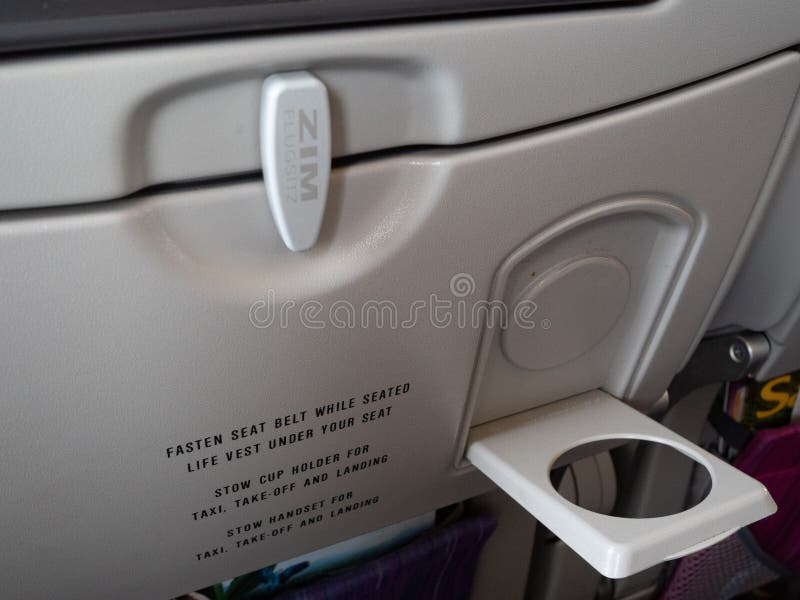 Cup Holder on Airplane Seat Stock Image - Image of drink, beverage