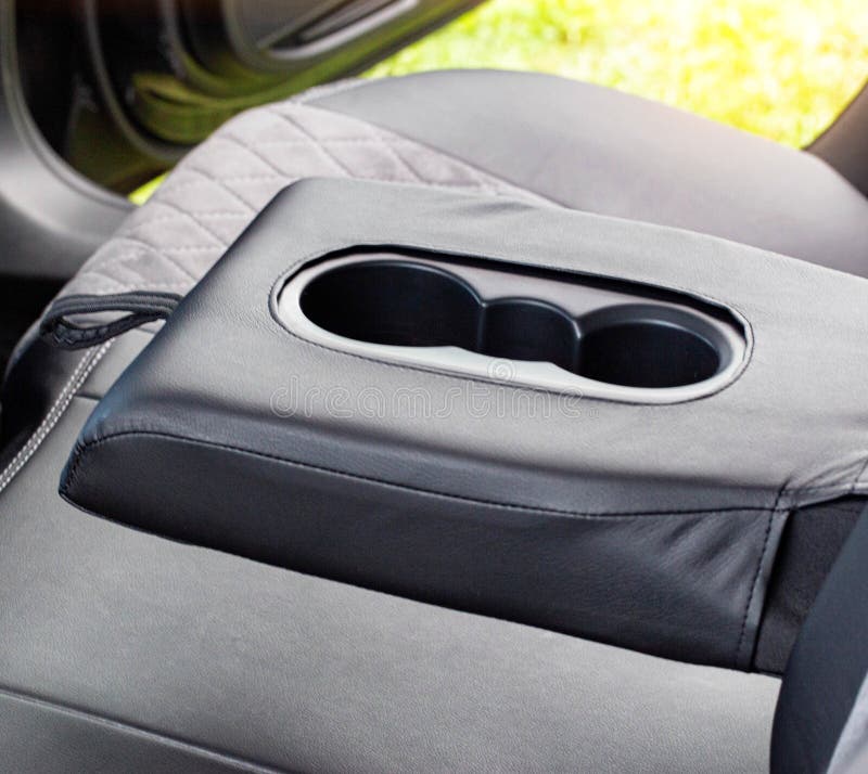 Cup Holder in the Armrest of a Modern Car, Interior Stock Photo Image