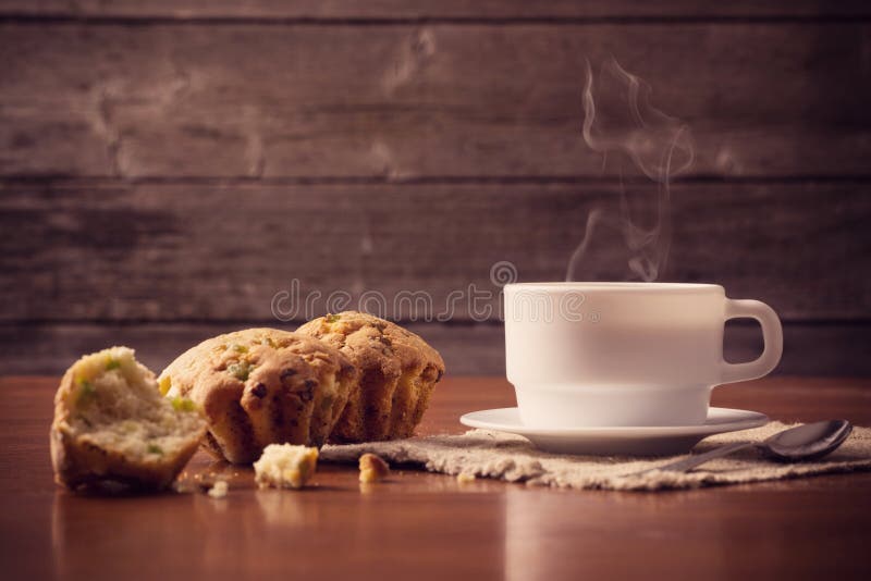 Cup of hot coffee with cake