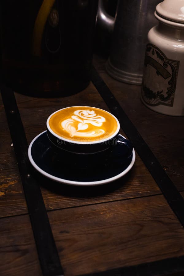 Red Coffee Cup With Heart Shape Latte Art On Wood Table At Cafe Stock