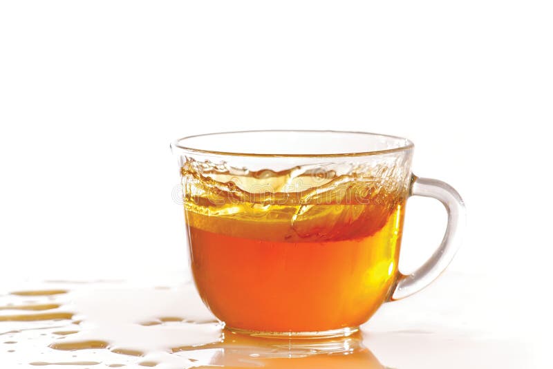 Cup of ice tea and lemon with splash royalty free stock photography Cup of ice tea and lemon with splash royalty free stock photography