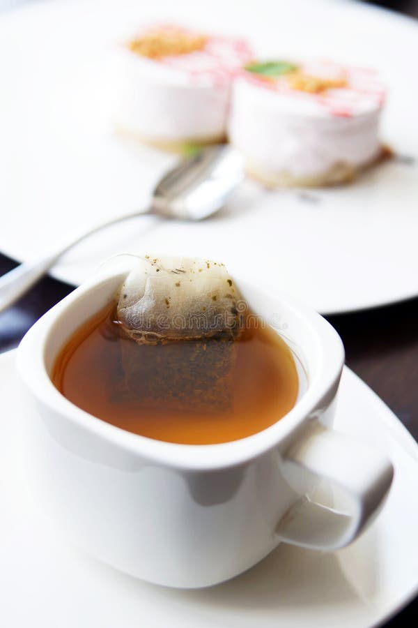 Cup of Morning Tea and Two Cakes on a Plate Stock Image Image of