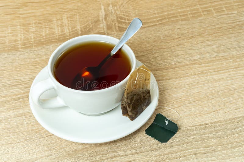 Cup on a Saucer with Tea and a Used Tea Bag Stock Photo Image of