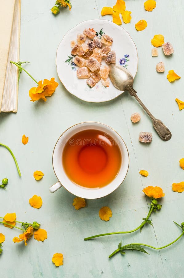 Cup of Tea with Brown Candi Sugar and Flowers Stock Image Image of