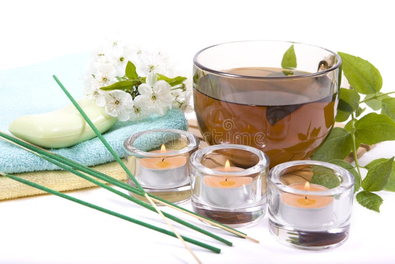 Cup of tea and candles stock photo. Image of green, mint 19376016