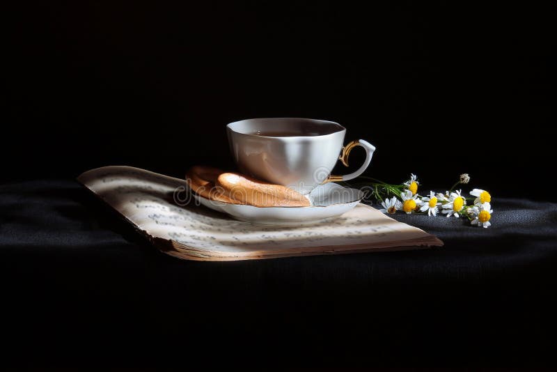 Cup of tea with daisies stock photos Cup of tea with daisies stock photos