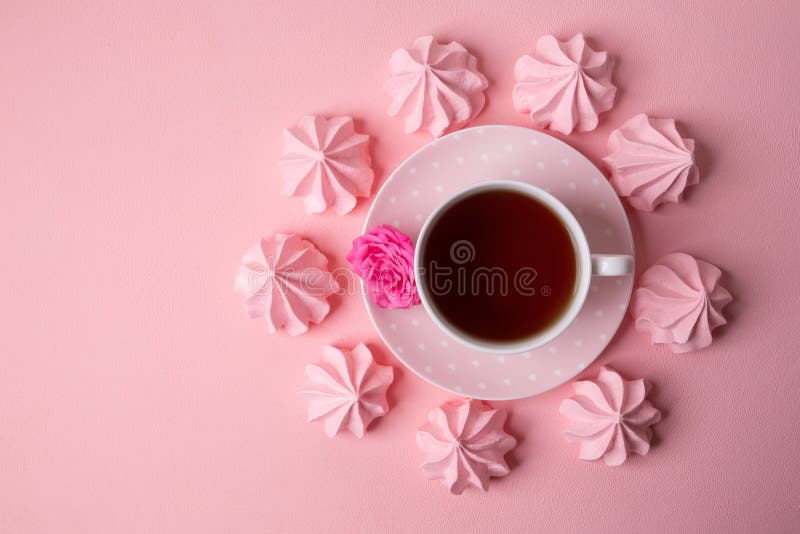 A cup of tea on a delicate pink background