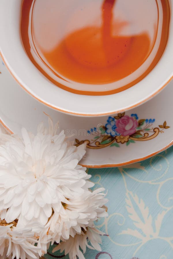 Cup of tea with flower
