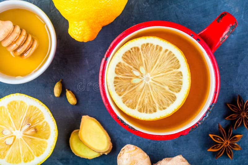 Cup of Tea with Ginger, Lemon, Honey, Anise and Cardamom Stock Photo