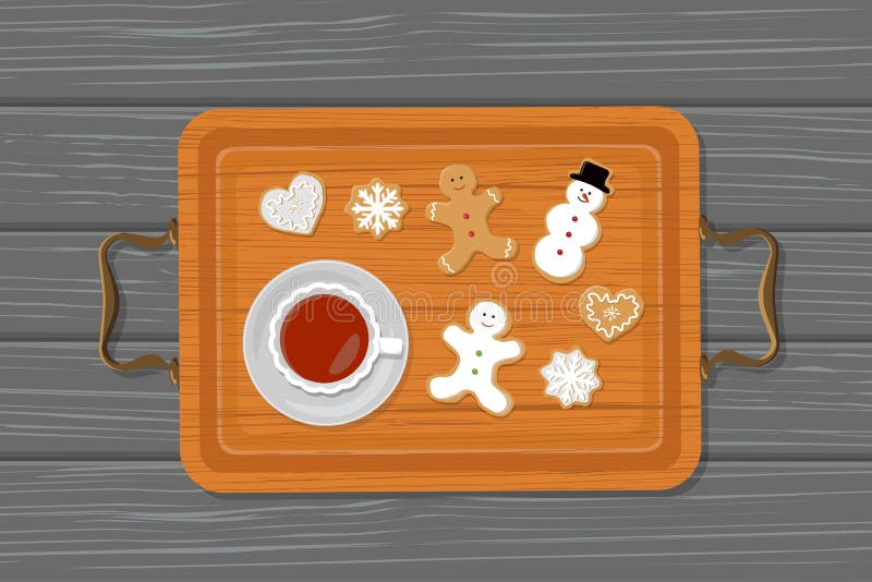 Cup of tea and gingerbread on tray