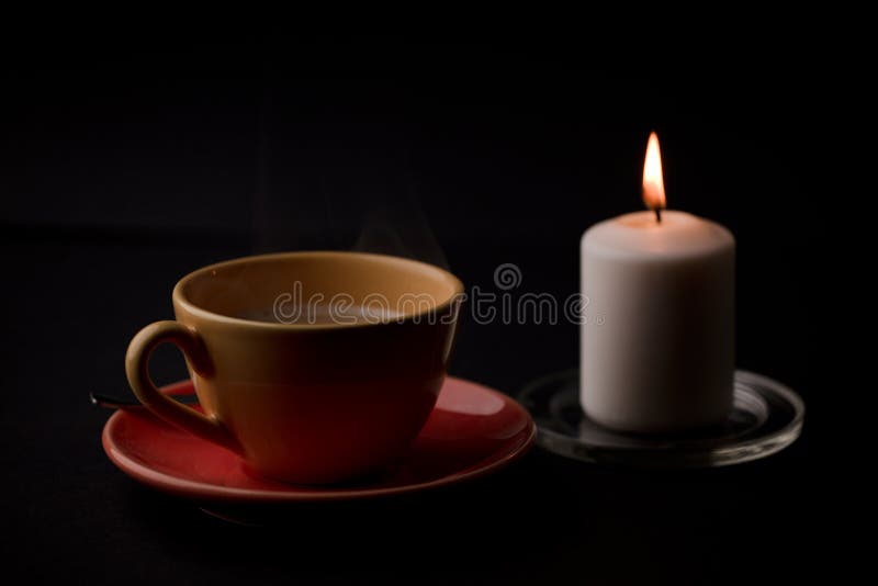 Cup of Tea with Hot Smoke and Lit Candle. on the Desk at Home, Power Outage  (focus on Cup). Stock Photo - Image of flame, evening: 233286940