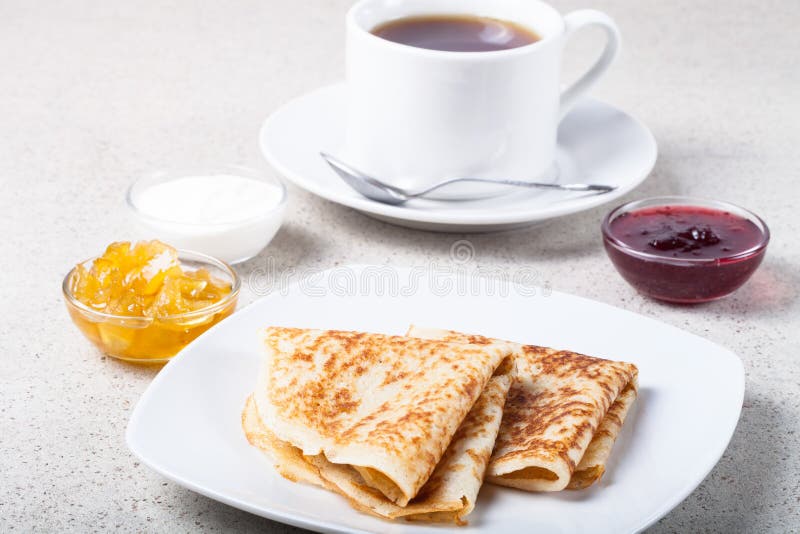 Cup of Tea with Jam, Sour Cream and Russian Pancakes Blini Stock