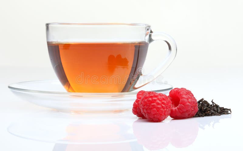 Cup of tea with raspberry stock photo Cup of tea with raspberry stock photo