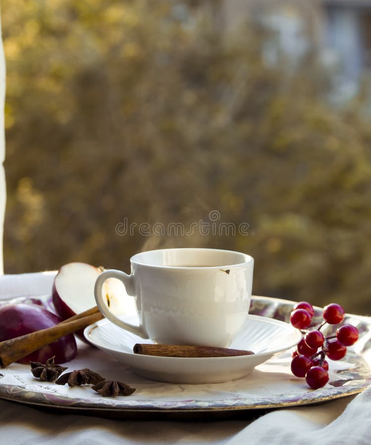 A Cup of Tea with Red Apples and Cinnamon Stock Photo Image of