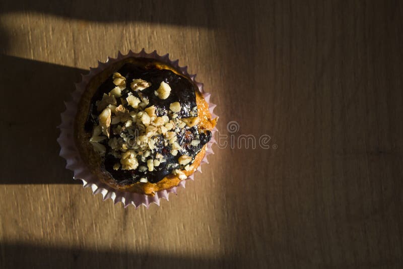 Cupcake with Chocolate Glaze and Nut Sprinkles Stock Photo Image of