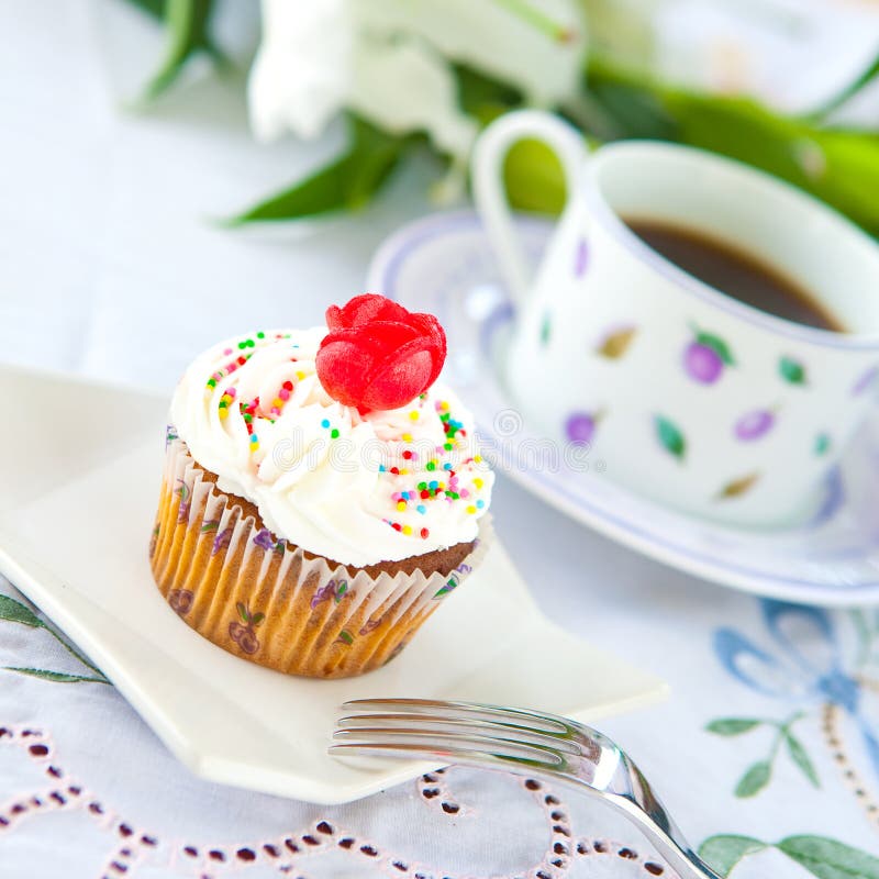 Cupcake with a cup of coffee