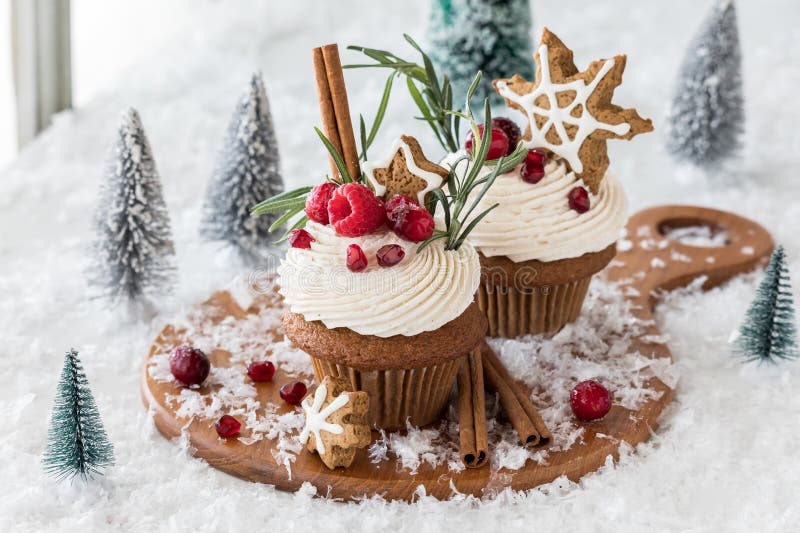 Decadent gingerbread cupcakes with buttercream frosting and star shaped cookies, for the holidays. Decadent gingerbread cupcakes with buttercream frosting and star shaped cookies, for the holidays.