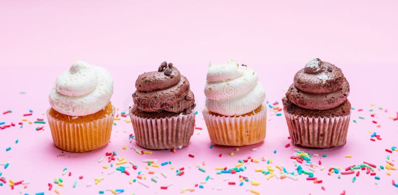 Cupcakes on pink background with colorful sprinkles, banner