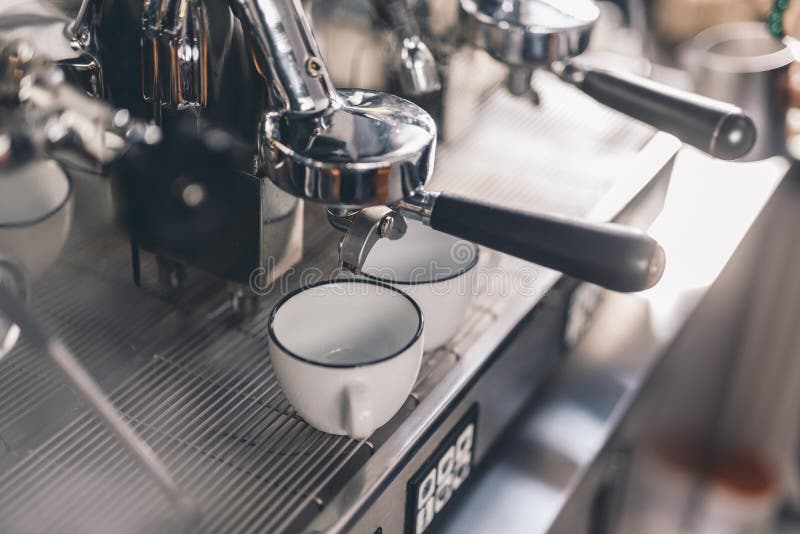 Cups for Espresso Standing on the Coffee Machine Tray Stock Photo