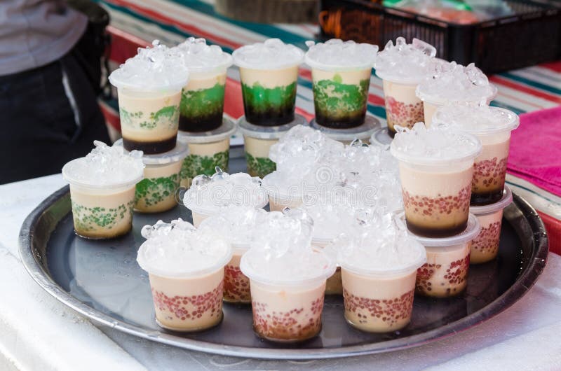 Cups of homemade pudding selling at the market stall royalty free stock image Cups of homemade pudding selling at the market stall royalty free stock image