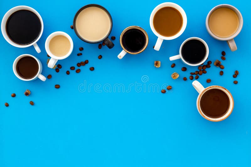 Cups of Hot Drinks on Blue Table Topdown Space for Text Stock Image