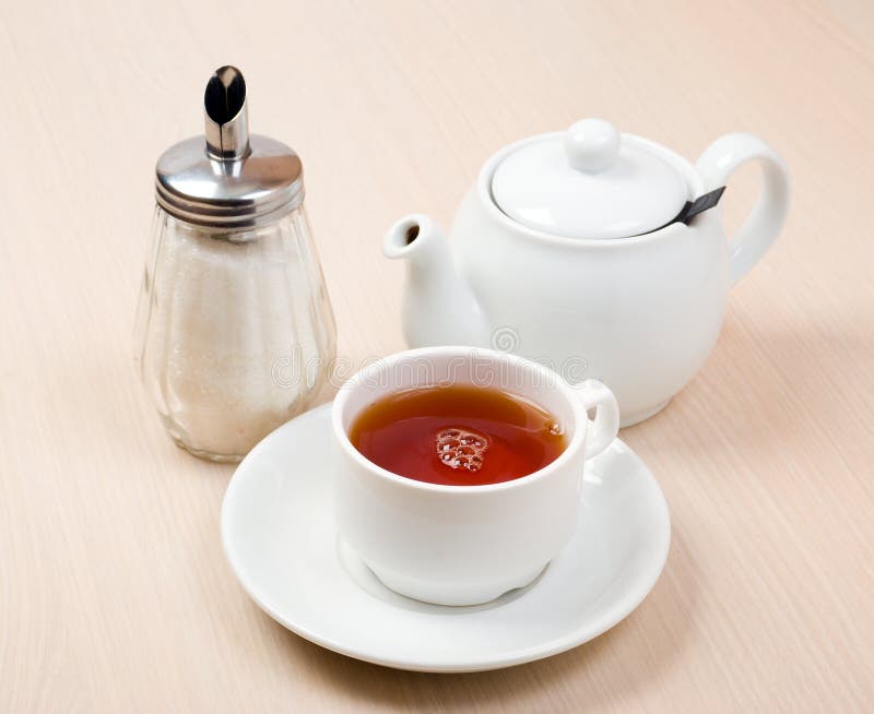 Cups of tea with a teapot stock image. Image of drink 12105613