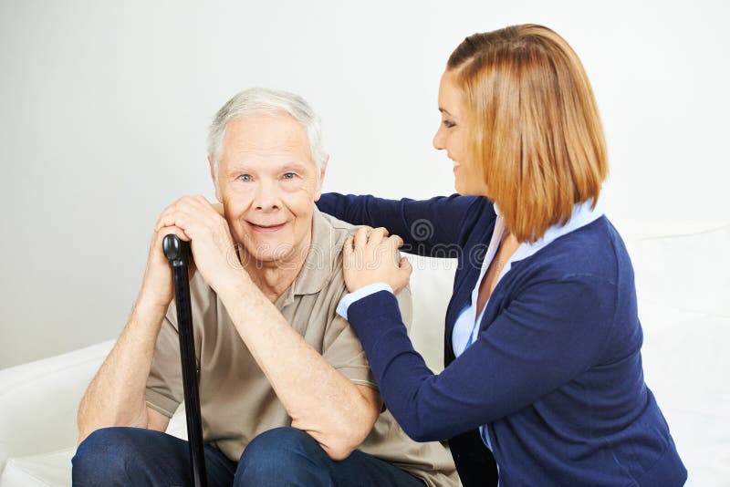 Daughter doing elderly care of senior men at home. Daughter doing elderly care of senior men at home