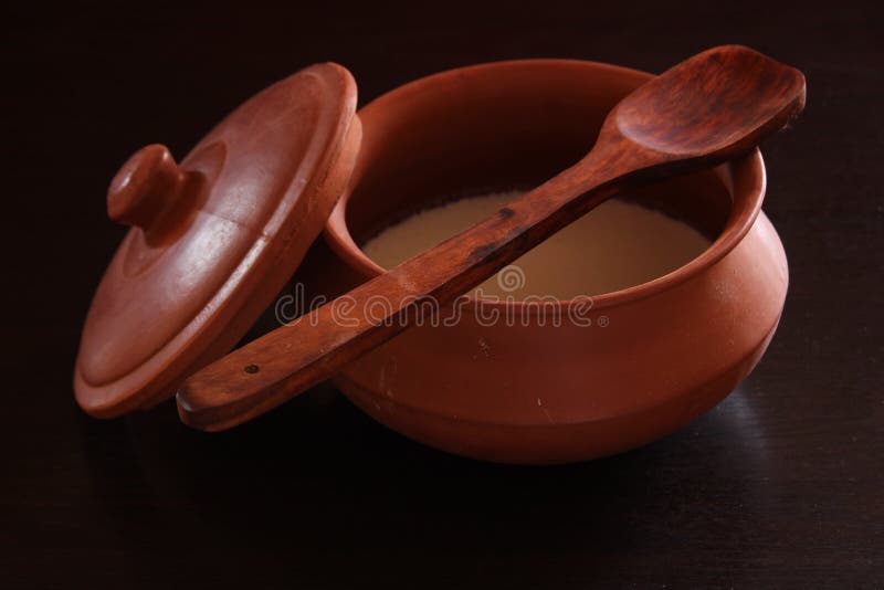 Curd/yogurt In Indian Clay Pot With Spetula With Black Background Stock Image Image of black